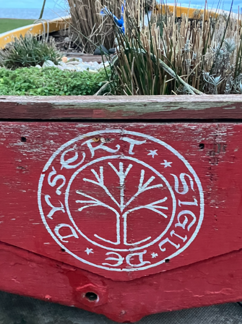Dinghy Beside Harbour With Motto